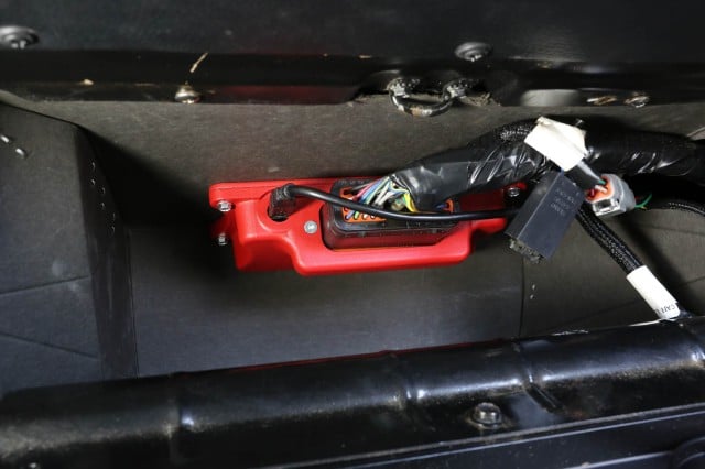 The XFI Sportsman ECU is small enough to tuck out of the way in our glovebox for easy access.