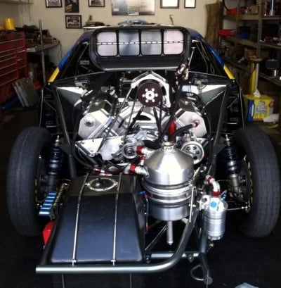The business end of NHRA Pro Modified racer Mike Janis' supercharged Camaro, with the vacuum pump shown at engine-left.