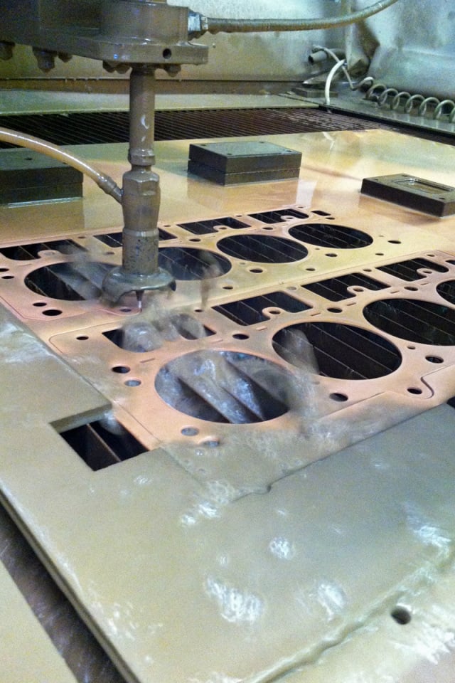 Once SCE has set forth the design parameters of the gasket, the waterjet gets to work cutting out the requisite copper.