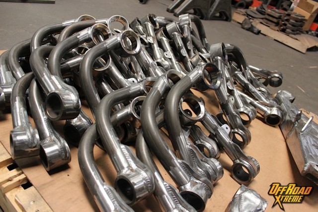 A production run of Camburg's current lineup of Toyota A-arms ready for powder coat and their new owners!