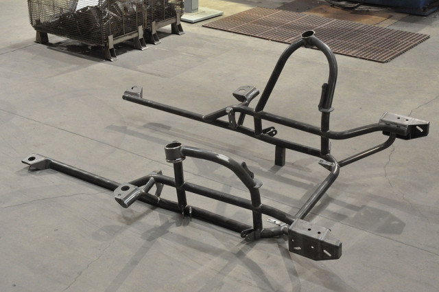 Shown is a completely welded assembly that is ready for shipping. The transmission cross-member and upper firewall support struts are attached during final installation on the vehicle.