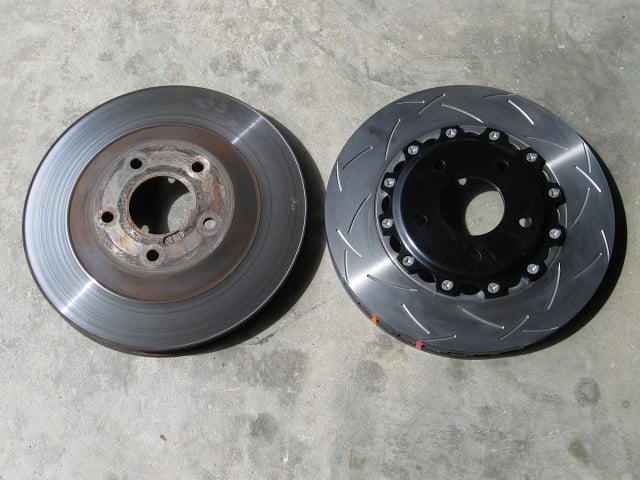Here, you can see a stock front rotor (left) compared to the new DBA disc.