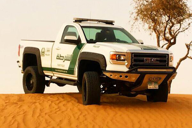 A 2015 GMC Sierra modified to Dubai PD specifications. White and green never looked so good on a truck.