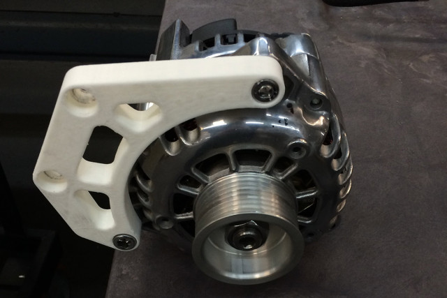 An example of an alternator bracket for a SB Chevy that was prototyped by COncept One using 3D printing techniques. Images via Concept One.