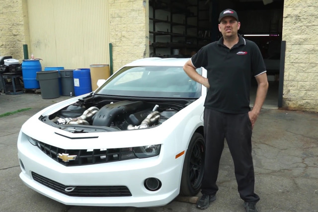 Tom Nelson stands next to his company's newest creation, a 2500 HP 632 Cubic innch-equipped beast of a 2012 COPO Camaro. Screenshot