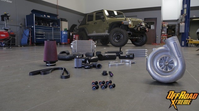 The ProCharger kit for the 3.6-liter V6-equipped Jeep Wrangler includes several components to replace stock pieces such as the intercooler, coolant overflow reservoir, air filter/intake system, and fuel injectors.