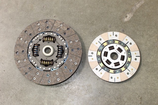 On the left side is the OEM LS7 clutch disc. While the stock clutch does a fantastic job of holding the original 505 crank horsepower, our application will eventually require us to upgrade to a smaller, lighter, and stronger assembly, like our new Mantic clutch disc on the right.