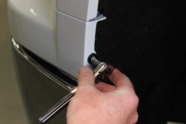 Tighten the hex-head bolts with a socket and ratchet.