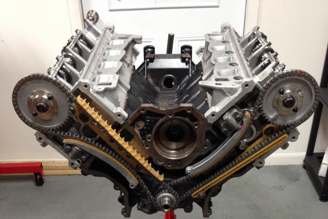 Overhead camshaft engines have a long center distance. Multiple chains are used on this Modular Ford engine.