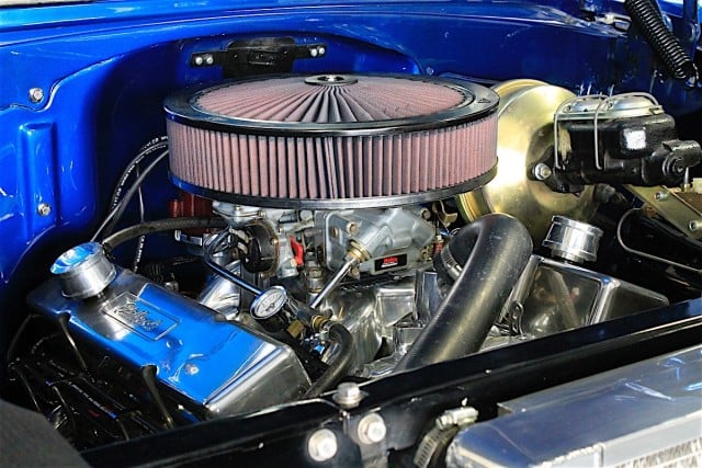 The Bel Air's engine bay is  pretty uncluttered with its old carb setup shown here. Fortunately, FAST's system is so compact and simple that you'd be hard pressed to notice the EFI system upon first glace in the engine bay after it's installed. 