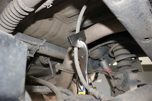 A clamp was placed on the central brake line to stop any leaking during the installation.