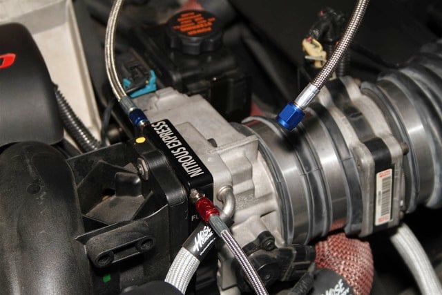 The Nitrous Express plate system for 3-bolt LS throttle bodies couldn't be much easier to install. It fits between the intake manifold and throttle body, and doesn't block any airflow like a single-nozzle wet system would.