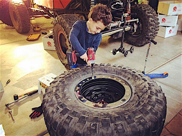 Smadja's son putting in work on some tires.