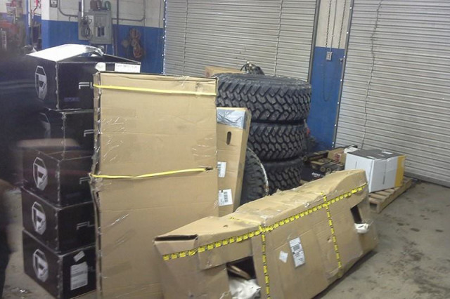 Lift kits and other accoutrement await installation in the shop.