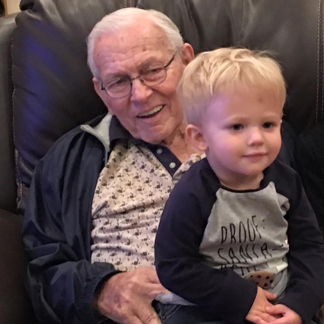 Frank Currie and one of his grandsons. Image Sourced: Casey Currie Facebook 