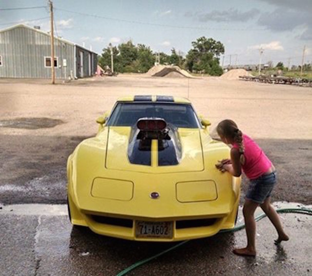 Wade's daughter puts a shine on his first drag car, his 1976 Chevy Corvette. (Note, the front end is from an early 80's Corvette.)