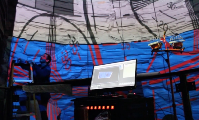 Six short-throw video projectors are carefully-aligned to completely fill visitors' fields of view and project high resolution graphics on the sculpted foam walls of the simulated cave. 