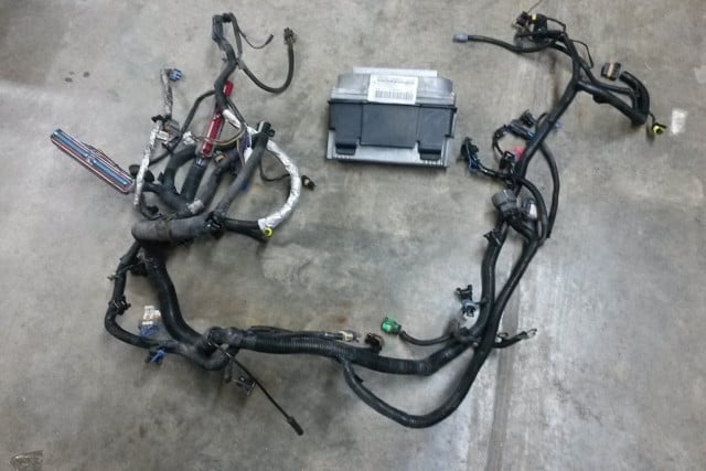 The harness and PCM from a '99 Camaro Z28 was bought and modified to fit the '01 C4. Image courtesy bigcommerce.com. 