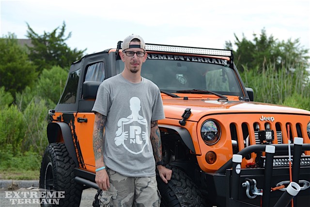 A shocked, surprised, and speechless owner standing with his upgraded Jeep.