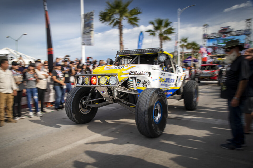 Class 1 buggy, #153 of Wilson Motorsports, taking off at the 2023 Baja 1000 race.